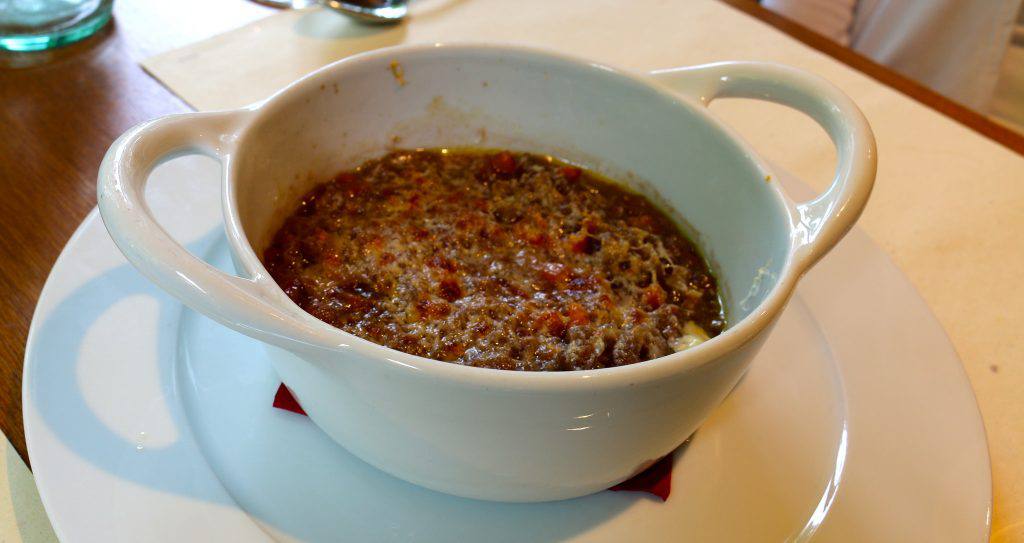gnudi Carabaccia with a crisp layer of melted parmesan cheese! - Pic by Ryan Snyder (Flickr Creative Commons)