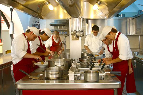 The beautiful open kitchen where Chef Nico Atrigna and his staff prepare the restaurant's signature dishes.