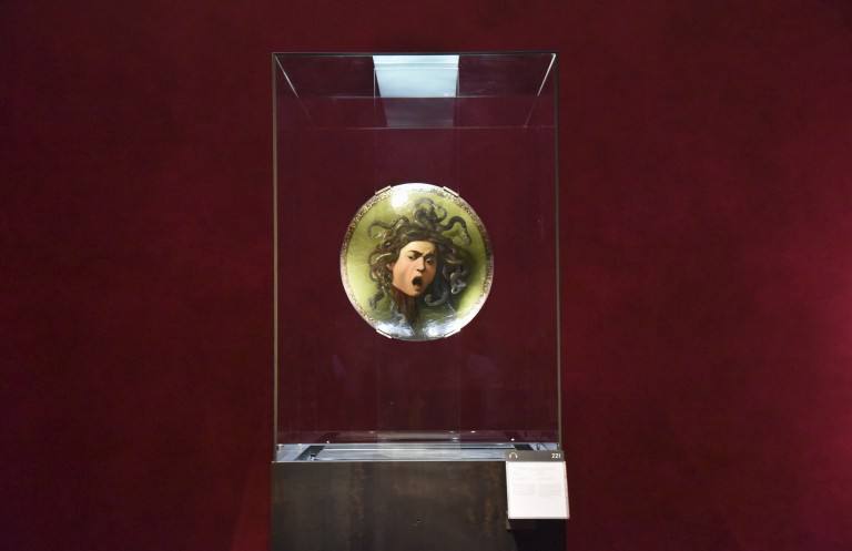 Caravaggio's head of Medusa in a new display with dramatic red walls - Florence Museums Caravaggio's head of Medusa in a new display with dramatic red walls - Florence Museums